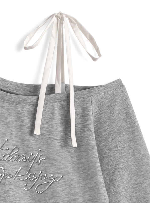 ワンショルダーリボン裾フリルロゴスタッズトップス