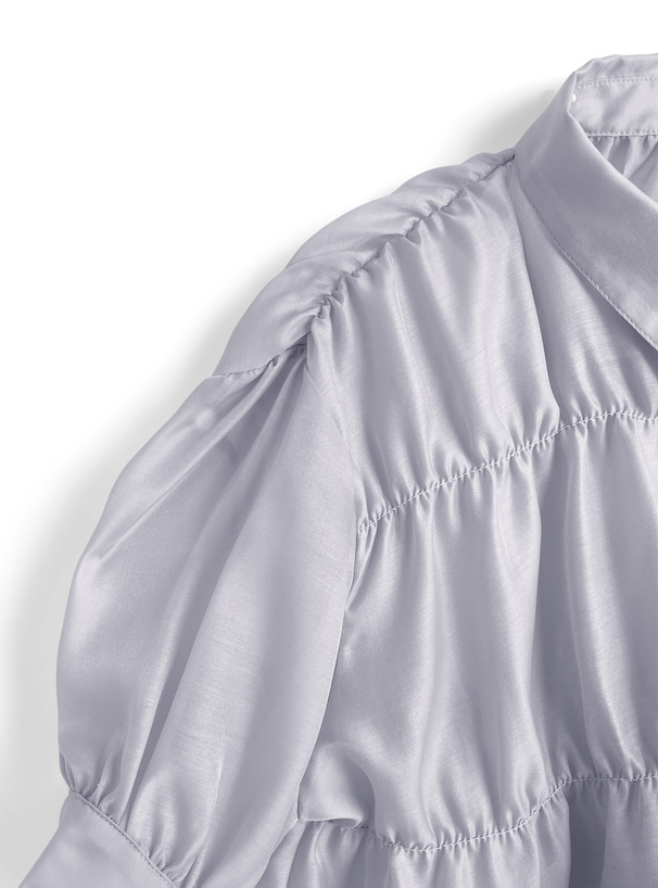 デザインボタンシャーリングシアーブラウス