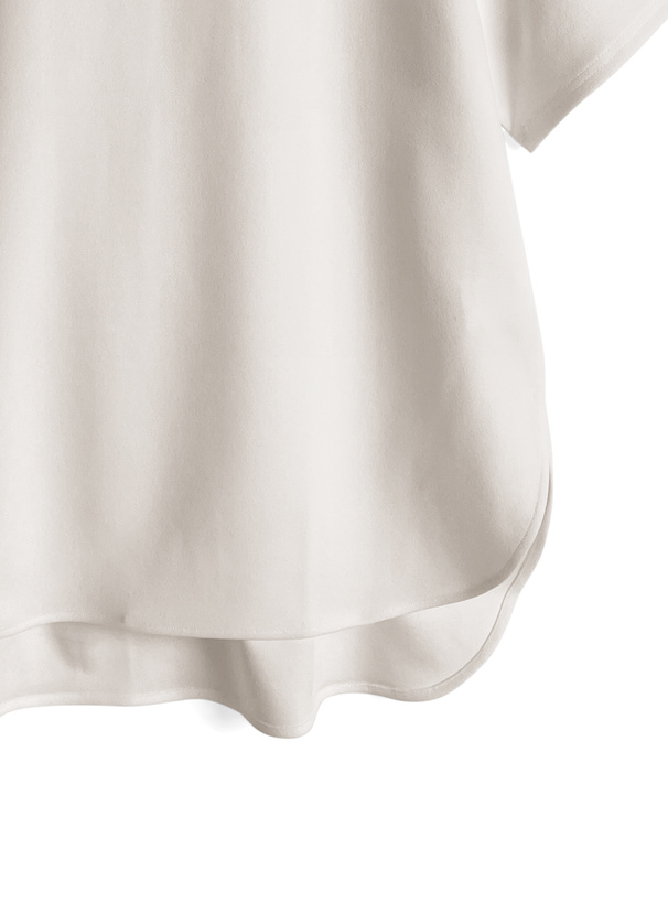 ラウンドヘムトップス